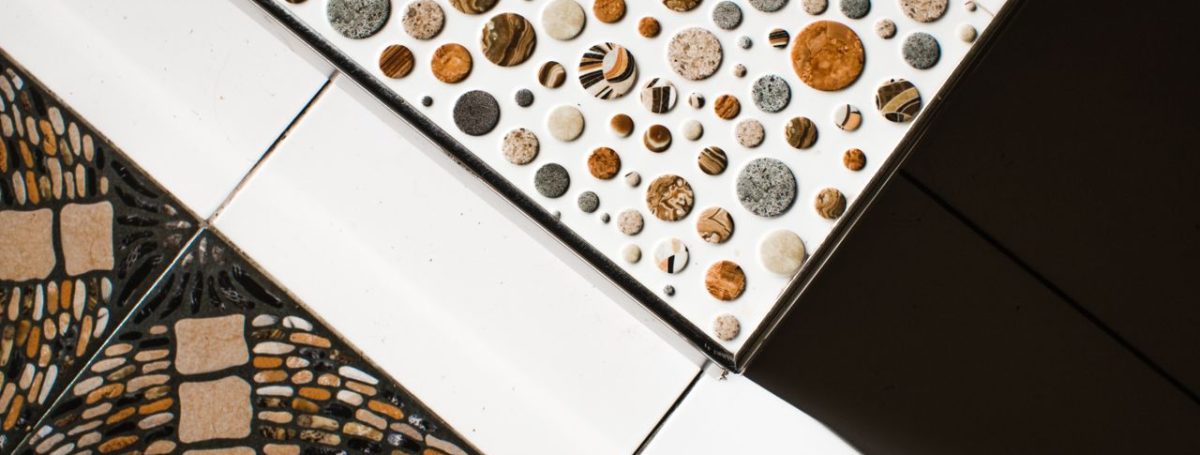 From above view of creative combination of different types of colored ceramic tiles